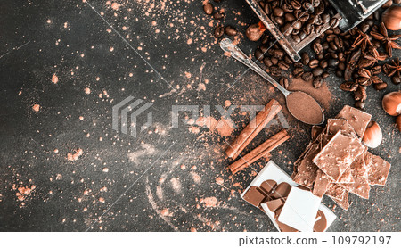 Chocolate, nuts, spices on table Chocolate, nuts, spices on table 109792197