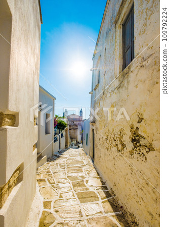 Narrow passage between stone walls, Lefkes, Greece Narrow passage between stone walls, Lefkes, Greece 109792224