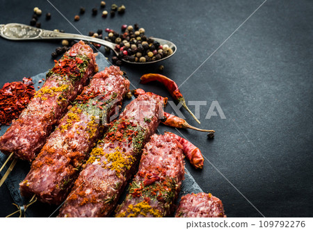 Raw kebab with spices 109792276