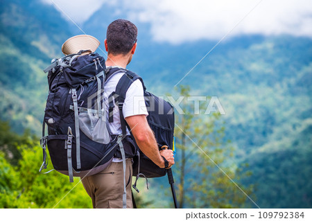 Tourist with backpacks enjoying view on the Annapurna track 109792384