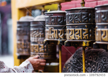 Prayer wheels in Boudhanath Stupa Prayer wheels in Boudhanath Stupa 109792433