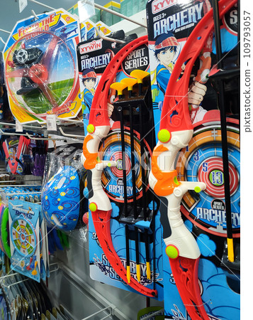 JOHOR, MALAYSIA -JULY 24, 2022: Children's toys are hung and displayed for sale. Toys are made in colorful colors and various designs to attract children's interest. Has a price tag. 109793057