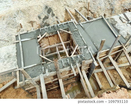 Melaka, Malaysia -February 2, 2022: Utility manhole under construction at a construction site. Built on site according to the engineer's design. Using plywood and timber as a construction mold Melaka, Malaysia -February 2, 2022: Utility manhole under construction at a construction site. Built on site according to the engineer's design. Using plywood and timber as a construction mold 109793110