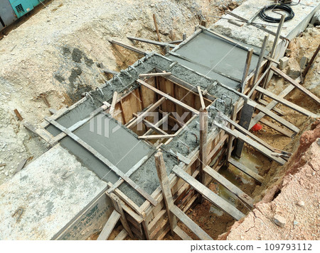 Melaka, Malaysia -February 2, 2022: Utility manhole under construction at a construction site. Built on site according to the engineer's design. Using plywood and timber as a construction mold Melaka, Malaysia -February 2, 2022: Utility manhole under construction at a construction site. Built on site according to the engineer's design. Using plywood and timber as a construction mold 109793112