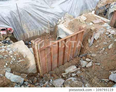 Melaka, Malaysia -February 2, 2022: Utility manhole under construction at a construction site. Built on site according to the engineer's design. Using plywood and timber as a construction mold Melaka, Malaysia -February 2, 2022: Utility manhole under construction at a construction site. Built on site according to the engineer's design. Using plywood and timber as a construction mold 109793119
