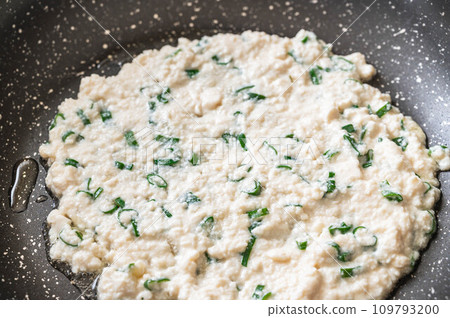 Tofu pancake dough baked in a frying pan 109793200