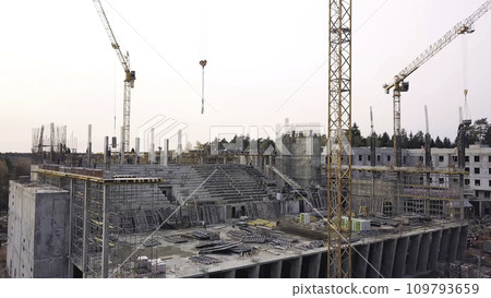 Top view see the construction site of Reinforced concrete high-rise Building. Clip. Top view of a building construction with tower cranes Top view see the construction site of Reinforced concrete high-rise Building. Clip. Top view of a building construction with tower cranes 109793659