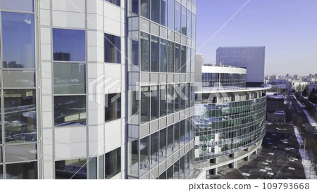 Closeup building glass of skyscrapers with cloud, Business concept of architecture. Reflection of the city in the Windows of a skyscraper Closeup building glass of skyscrapers with cloud, Business concept of architecture. Reflection of the city in the Windows of a skyscraper 109793668