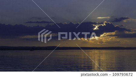 beautiful sunset over of a lake 109793672