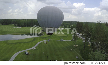 Big air balloon in white color with basket. Aerial on the big balloon 109793721