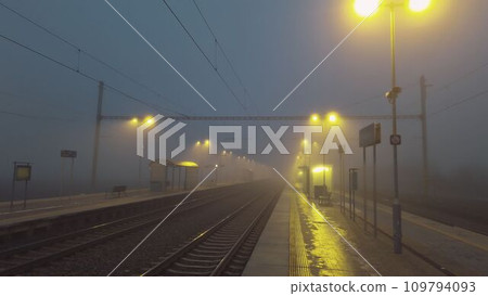 The station at night and in the fog. Railway station in night, darkness and mist. The concept of loneliness, sadness and also hope 109794093