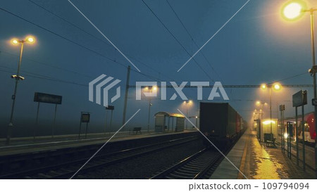 The station at night and in the fog. Railway station in night, darkness and mist. The concept of loneliness, sadness and also hope 109794094