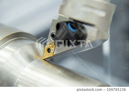 Close up  the  chip insert on the lathe machine in the light blue scene. 109795236