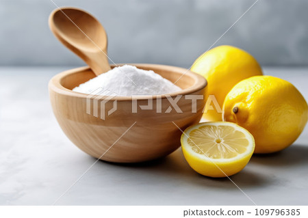 Citrus Infusion: Household Cleaning with Sliced Lemon and Baking Soda Citrus Infusion: Household Cleaning with Sliced Lemon and Baking Soda 109796385