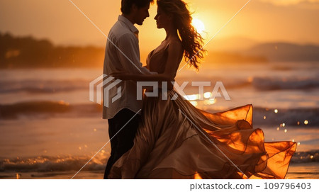 Seashore Serenade: Young Couple in Love Dancing in Beautiful Outfits at Sunset Seashore Serenade: Young Couple in Love Dancing in Beautiful Outfits at Sunset 109796403