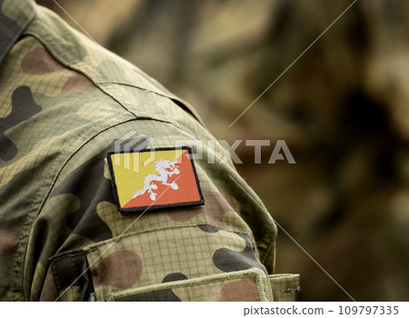Flag of Bhutan on military uniform. Army, armed forces, soldiers. Collage. Flag of Bhutan on military uniform. Army, armed forces, soldiers. Collage. 109797335