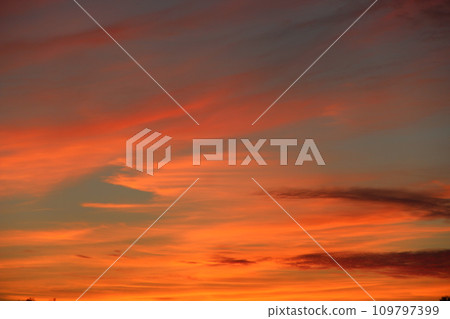 Orange sunset before night. Twilight with bright sunset. Evening landscape Orange sunset before night. Twilight with bright sunset. Evening landscape 109797399