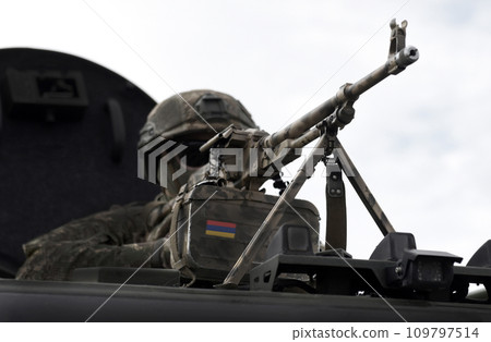 Flag of Armenia on a machine gun. Military Conflict in the Caucasus. Collage. Flag of Armenia on a machine gun. Military Conflict in the Caucasus. Collage. 109797514