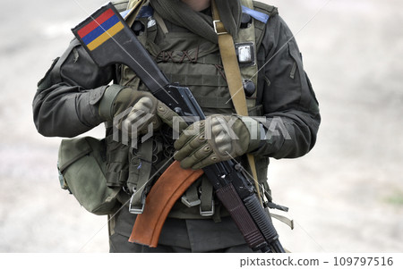 Flag of Armenia on submachine gun butt. Military Conflict in the Caucasus. Collage. Flag of Armenia on submachine gun butt. Military Conflict in the Caucasus. Collage. 109797516