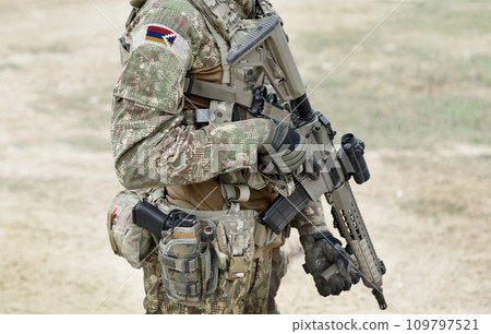 Soldier with machine gun and flag on military uniform of Artsakh and also known as Nagorno-Karabakh Republic. Collage. 109797521