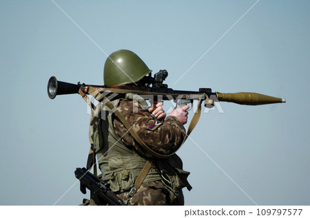 Soldier with antitank grenade launcher and flag of Artsakh and also known as Nagorno-Karabakh Republic on military uniform. Collage. 109797577