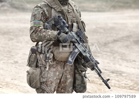Soldier with assault rifle and flag of Azerbaijan on military uniform. Collage. Soldier with assault rifle and flag of Azerbaijan on military uniform. Collage. 109797589