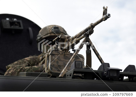 Soldier with a machine gun. Caucasus war. Military Conflict in the Caucasus Soldier with a machine gun. Caucasus war. Military Conflict in the Caucasus 109797669
