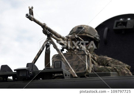 Soldier with a machine gun. Caucasus war. Military Conflict in the Caucasus Soldier with a machine gun. Caucasus war. Military Conflict in the Caucasus 109797725