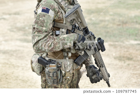 Soldier with assault rifle and flag of New Zealand on military uniform. Collage. 109797745