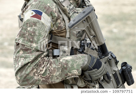 Soldier with assault rifle and flag of Philippines on military uniform. Collage. Soldier with assault rifle and flag of Philippines on military uniform. Collage. 109797751