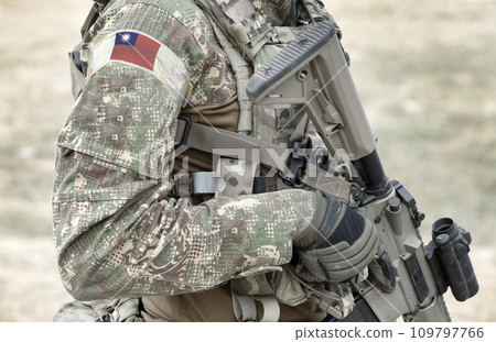 Soldier with assault rifle and flag of Taiwan on military uniform. Collage. 109797766