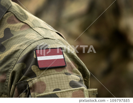 Flag of Latvia on military uniform. Army, troops, soldiers. Collage. Flag of Latvia on military uniform. Army, troops, soldiers. Collage. 109797885