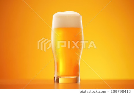 a glass of beer on an orange background 109798413