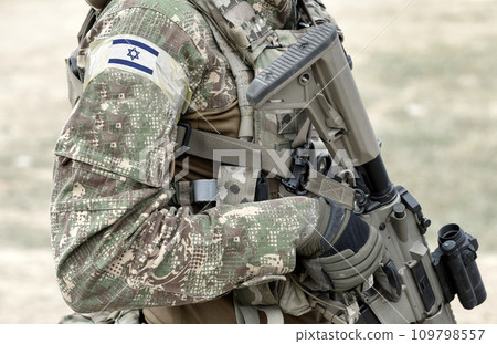 Soldier with assault rifle and flag of Israel on military uniform. Collage. Soldier with assault rifle and flag of Israel on military uniform. Collage. 109798557