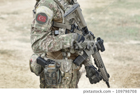 Soldier with machine gun and flag of Turkey on military uniform. Collage. 109798708