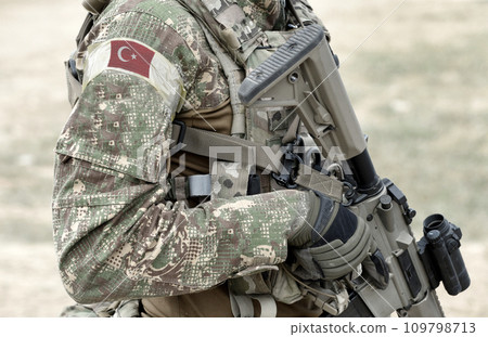 Soldier with assault rifle and flag of Turkey on military uniform. Collage. 109798713