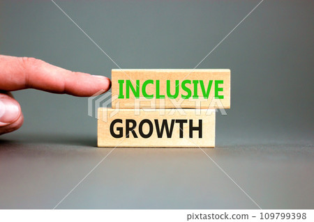 Inclusive growth symbol. Concept words Inclusive growth on beautiful wooden blocks. Beautiful grey table grey background. Businessman hand. Business inclusive growth concept. Copy space. Inclusive growth symbol. Concept words Inclusive growth on beautiful wooden blocks. Beautiful grey table grey background. Businessman hand. Business inclusive growth concept. Copy space. 109799398
