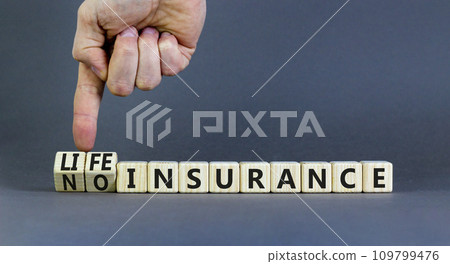 Life or no insurance symbol. Concept words Life insurance No insurance on wooden blocks. Beautiful grey table grey background. Businessman hand. Business Life or no insurance concept. Copy space. Life or no insurance symbol. Concept words Life insurance No insurance on wooden blocks. Beautiful grey table grey background. Businessman hand. Business Life or no insurance concept. Copy space. 109799476