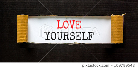 Love yourself symbol. Concept words Love yourself on beautiful white paper. Beautiful black paper background. Psychology love yourself concept. Copy space. Love yourself symbol. Concept words Love yourself on beautiful white paper. Beautiful black paper background. Psychology love yourself concept. Copy space. 109799548