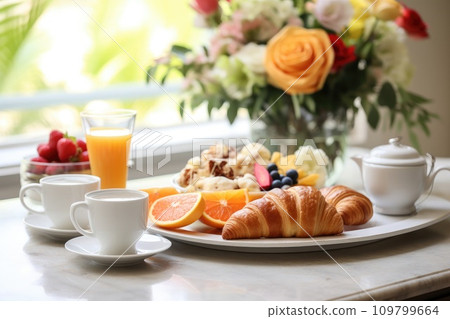 A gourmet morning spread, pastries, fresh fruits, and inviting coffee, plus generous copy space A gourmet morning spread, pastries, fresh fruits, and inviting coffee, plus generous copy space 109799664