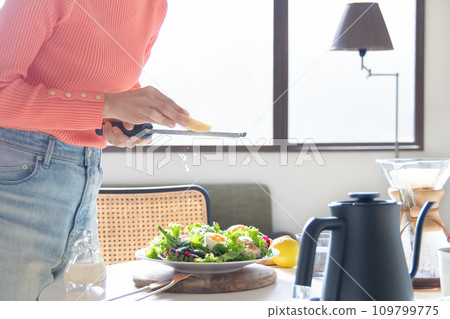 woman making salad woman making salad 109799775