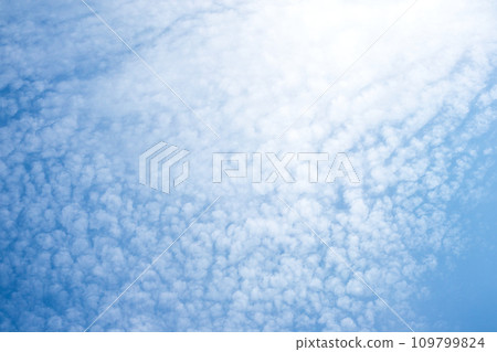 Fluffy white clouds on blue sky 109799824