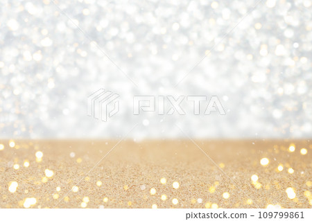 Shiny vintage bokeh lights on a silver and gold background. 109799861