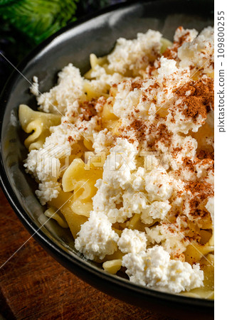 Pasta with cottage cheese, cinnamon and sugar. Pasta with cottage cheese, cinnamon and sugar. 109800255