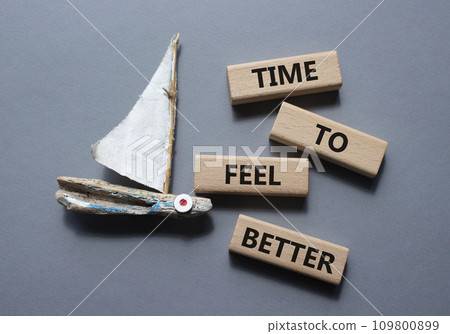 Time to feel better symbol. Wooden blocks with words Time to feel better. Beautiful grey background with boat. Medicine and Time to feel better concept. Copy space. Time to feel better symbol. Wooden blocks with words Time to feel better. Beautiful grey background with boat. Medicine and Time to feel better concept. Copy space. 109800899