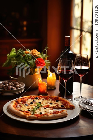 Tasty Italian dinner scene with pizza, pasta, and wine, leaving room for text Tasty Italian dinner scene with pizza, pasta, and wine, leaving room for text 109801126