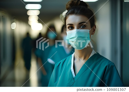 female medical workers with surgical masks in front of a hallway female medical workers with surgical masks in front of a hallway 109801307