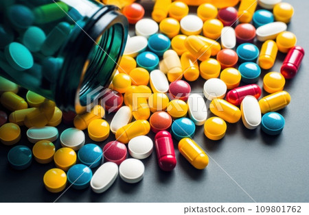 one bottle of medicine with multicolored pills one bottle of medicine with multicolored pills 109801762