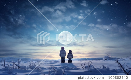 two young boys stand in the snow overlooking a white moon 109802540