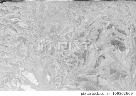 Frosty patterns on glass, abstract background Frosty patterns on glass, abstract background 109802669